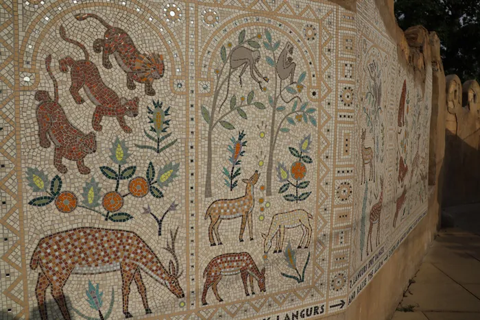 A finely tiled mosaic at London Zoo, showing animals on a off-white background.