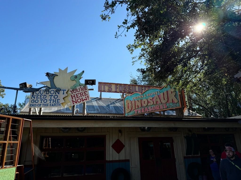 Shop signs in the DinoLand USA area, themed to extinction