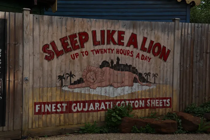 In-world advertisment for bedsheets at London Zoo 'Sleep like a lion up to twenty hours a day'